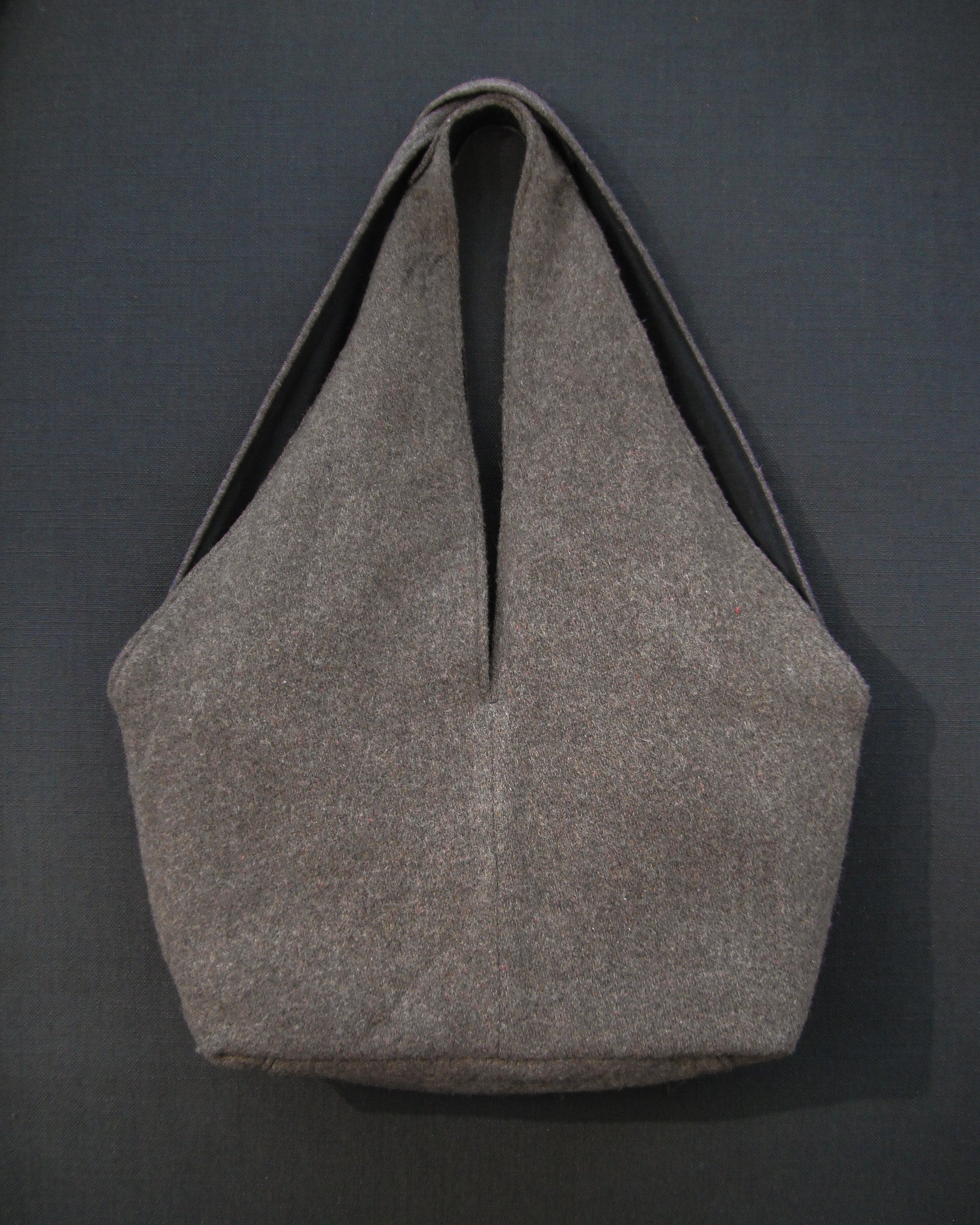 Gray tote bag on a dark gray background