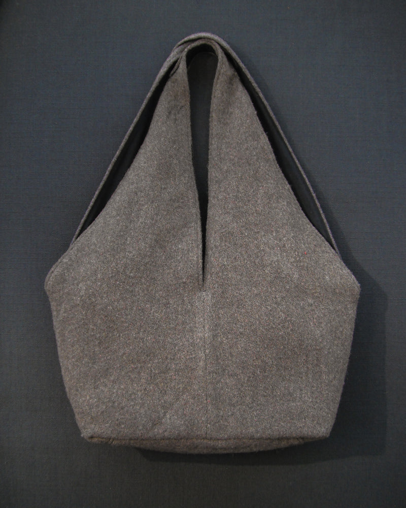 Gray tote bag on a dark gray background