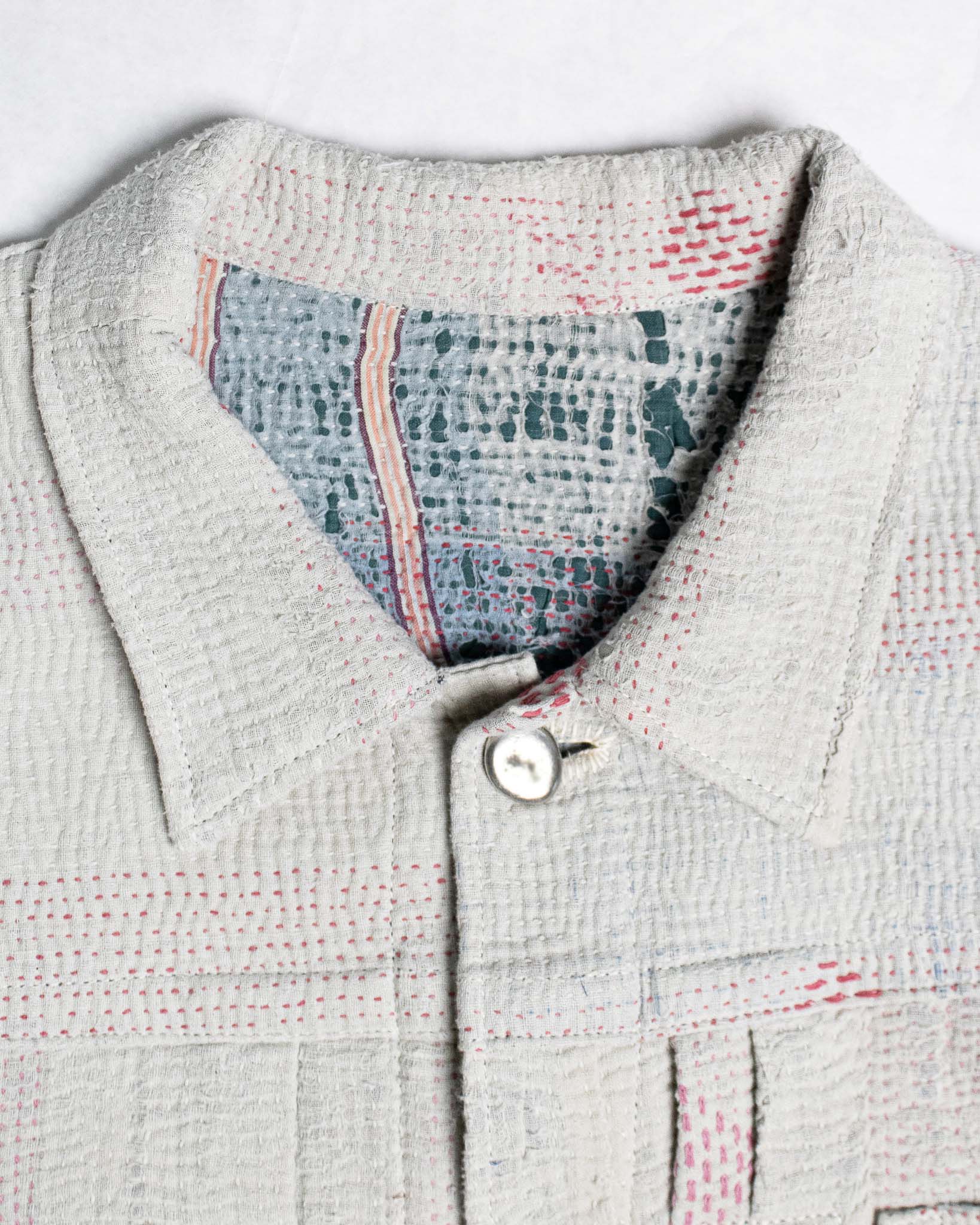 Detail of white kantha quilt Jacket