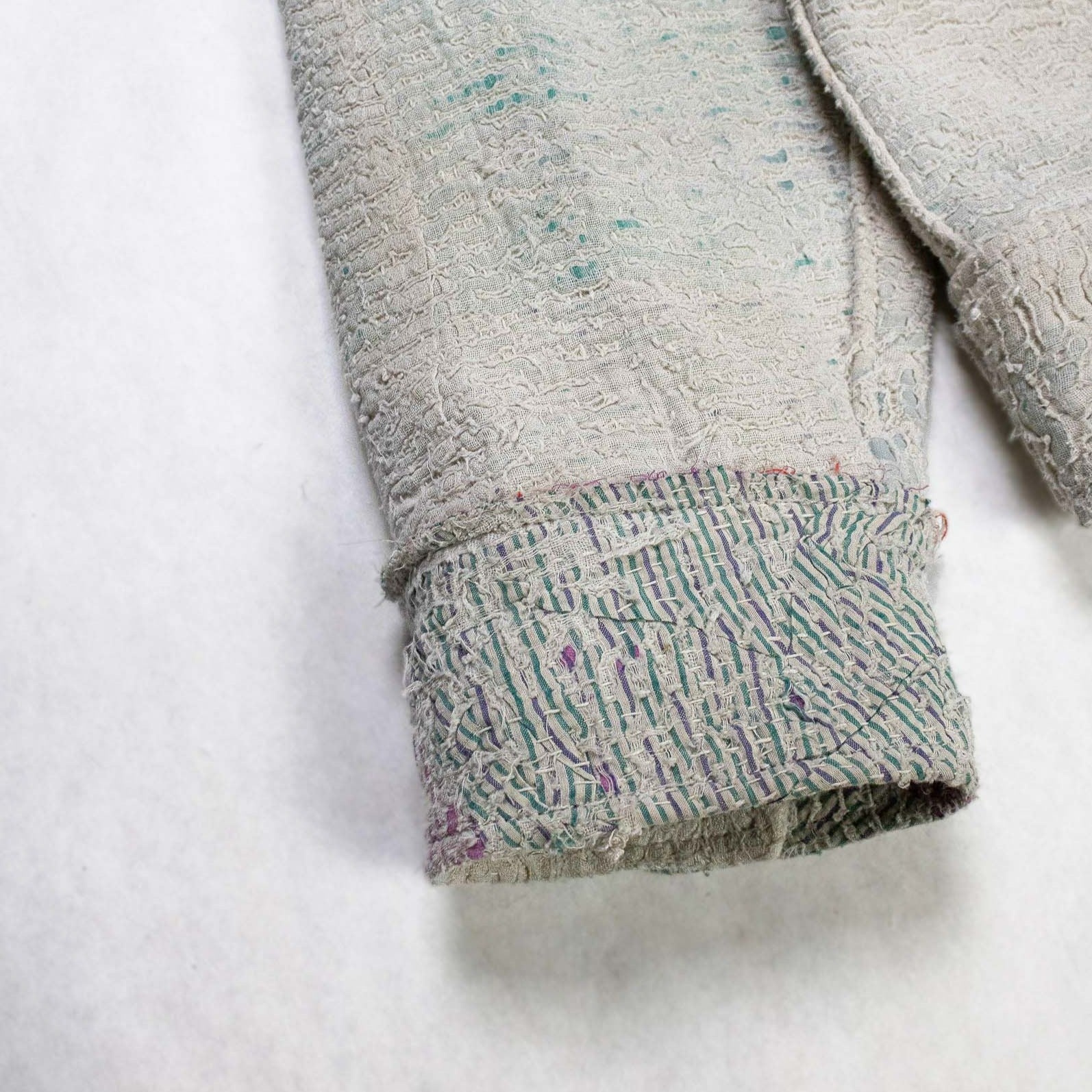 Detail of white Kantha Quilt Jacket sleeve