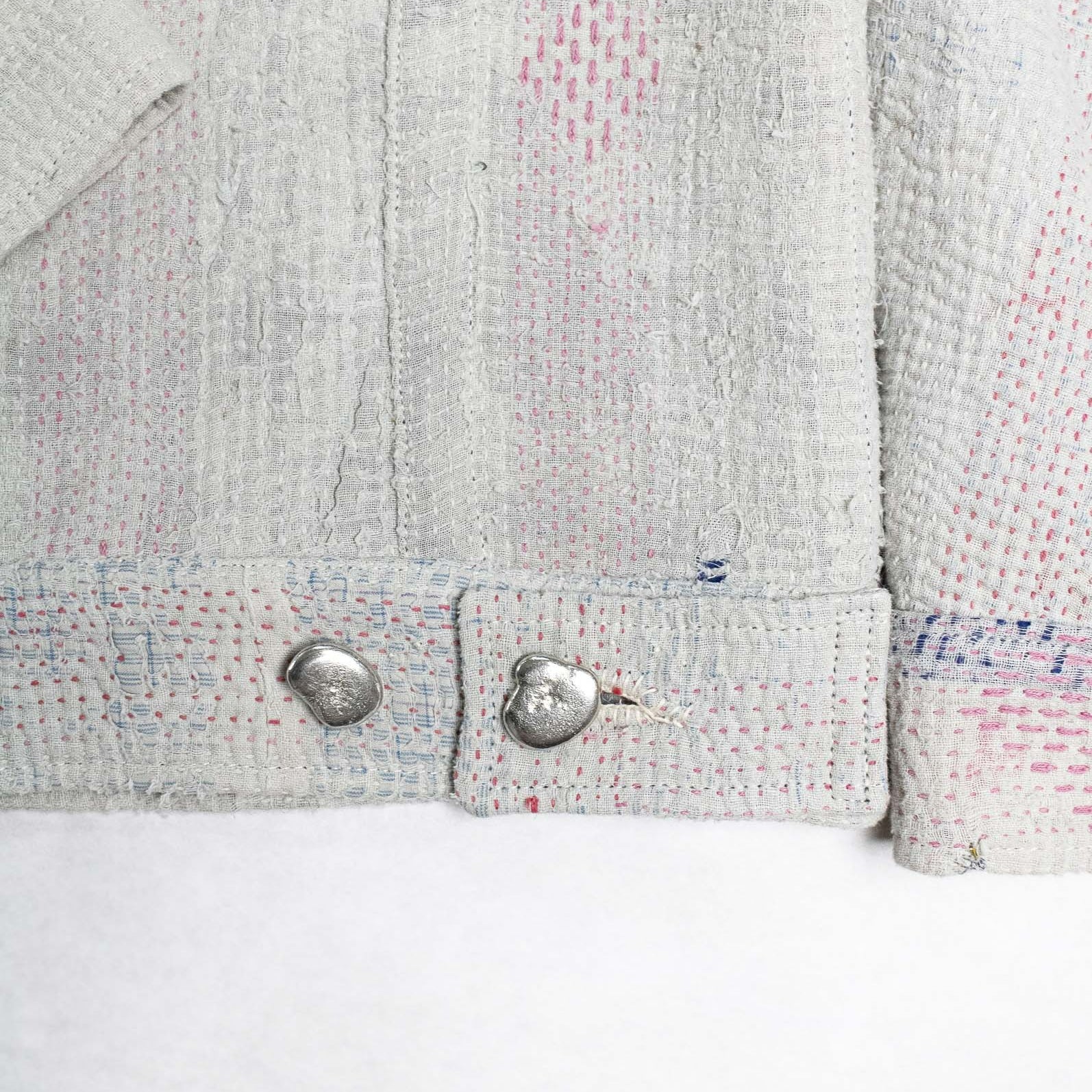 Detail of white kantha quilt Jacket